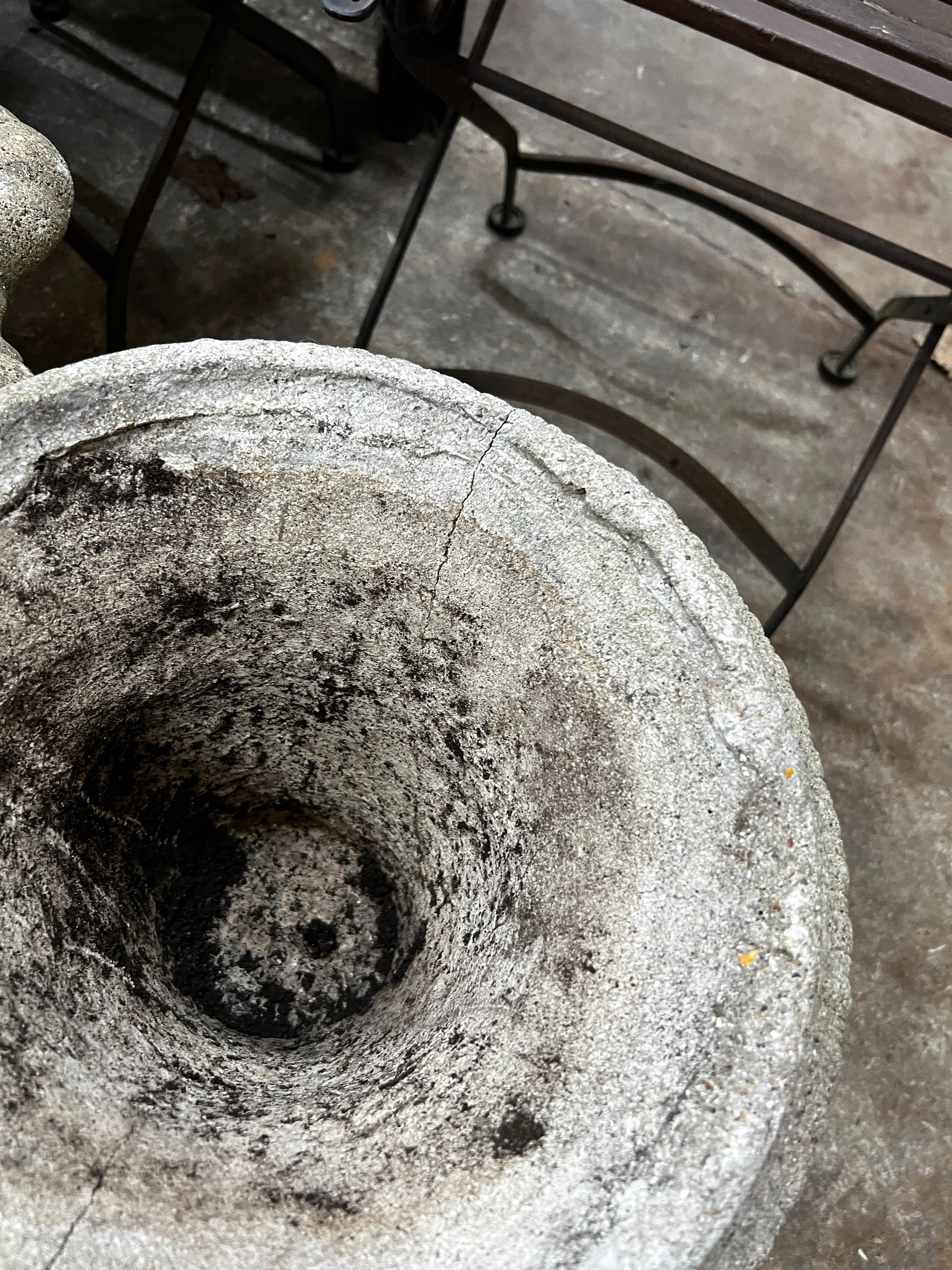 Three circular reconstituted stone garden urns, the largest diameter 48cm, height 55cm